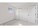 Bright bedroom with neutral carpet, closet, window, and white walls at 2815 Kay Ellen Dr, Indianapolis, IN 46229