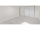 Neutral bedroom with carpet, closet, and adjacent doorway at 2815 Kay Ellen Dr, Indianapolis, IN 46229