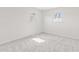 Sunlit bedroom with soft carpet and two windows at 2815 Kay Ellen Dr, Indianapolis, IN 46229