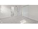 Bright bedroom with neutral decor, closet and ensuite bathroom with marble-look tile flooring at 2815 Kay Ellen Dr, Indianapolis, IN 46229