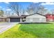 Charming ranch-style home featuring a freshly painted exterior and well-manicured lawn at 2815 Kay Ellen Dr, Indianapolis, IN 46229