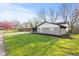 Side view of a delightful ranch-style home with a lush green lawn and landscaping at 2815 Kay Ellen Dr, Indianapolis, IN 46229