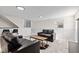 Modern living room in finished basement featuring seating area, stylish floors, and decor, perfect for relaxing at 2815 Kay Ellen Dr, Indianapolis, IN 46229