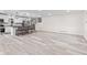 Open living space with hardwood floors, a kitchen breakfast bar, and stairs for a bright, flowing living area at 2815 Kay Ellen Dr, Indianapolis, IN 46229