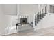 Modern staircase featuring sleek black metal railings and neutral carpeting at 2815 Kay Ellen Dr, Indianapolis, IN 46229