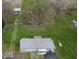 Sprawling property featuring lush lawns, mature trees, and a charming home with a metal roof at 3335 W 400 N, Anderson, IN 46011