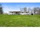 Spacious backyard featuring a patio, grill, and lush green grass at 3335 W 400 N, Anderson, IN 46011