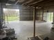Spacious barn interior featuring a large open area with high ceilings and natural light, suitable for multiple uses at 3335 W 400 N, Anderson, IN 46011