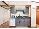 Efficient kitchen with sleek gray cabinets, offering a modern aesthetic at 3335 W 400 N, Anderson, IN 46011