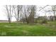 Expansive green lawn with scattered trees, providing a tranquil setting on the property at 3335 W 400 N, Anderson, IN 46011