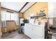 Functional laundry room with a washer, dryer, shelving, and a window at 3335 W 400 N, Anderson, IN 46011