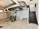 Unfinished basement with utilities, black stairs and white walls at 3516 N Capitol Ave, Indianapolis, IN 46208
