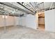 Unfinished basement with exposed ceiling, white walls, and support beams at 3516 N Capitol Ave, Indianapolis, IN 46208