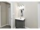 Modern bathroom vanity with a sink, storage, and a stylish light fixture at 3516 N Capitol Ave, Indianapolis, IN 46208