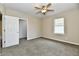 Neutral bedroom with plush carpet, ceiling fan, and window provides a relaxing retreat at 3516 N Capitol Ave, Indianapolis, IN 46208