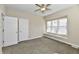 This bedroom has neutral paint, plush carpet, and a bright window seat at 3516 N Capitol Ave, Indianapolis, IN 46208