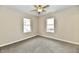 Corner bedroom featuring neutral paint, carpeting, and two large windows at 3516 N Capitol Ave, Indianapolis, IN 46208