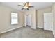 Neutral bedroom features plush carpet, a window, closet, and a ceiling fan at 3516 N Capitol Ave, Indianapolis, IN 46208