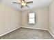 Comfortable bedroom featuring neutral paint, carpeting, and a single window at 3516 N Capitol Ave, Indianapolis, IN 46208