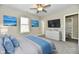 Bright bedroom with ceiling fan, large windows, and ensuite bathroom at 3516 N Capitol Ave, Indianapolis, IN 46208