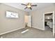 Comfortable bedroom showcases a ceiling fan, window, and convenient ensuite bathroom at 3516 N Capitol Ave, Indianapolis, IN 46208