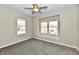 Cozy bedroom featuring neutral paint, carpeting, and large window at 3516 N Capitol Ave, Indianapolis, IN 46208