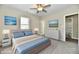 Bright bedroom with ceiling fan, large windows, and ensuite bathroom at 3516 N Capitol Ave, Indianapolis, IN 46208