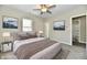 Bright bedroom with ceiling fan, large windows, and ensuite bathroom at 3516 N Capitol Ave, Indianapolis, IN 46208