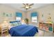Bright bedroom with two windows, white furniture, and decor at 3516 N Capitol Ave, Indianapolis, IN 46208