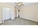 Bedroom boasts a ceiling fan and carpet, with closet and ensuite bathroom entrance at 3516 N Capitol Ave, Indianapolis, IN 46208