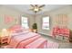 Charming pink bedroom with two windows, storage unit and decor at 3516 N Capitol Ave, Indianapolis, IN 46208