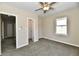 Airy bedroom offers two doorways, a window, carpeted floor, and a ceiling fan at 3516 N Capitol Ave, Indianapolis, IN 46208