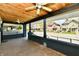 Covered porch with two ceiling fans and dark trimwork, giving a clear view of the street at 3516 N Capitol Ave, Indianapolis, IN 46208