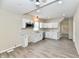 Bright kitchen featuring white cabinets, stainless steel appliances, and modern flooring at 3516 N Capitol Ave, Indianapolis, IN 46208