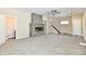 Spacious living room with fireplace, stairs, and open entryways at 3516 N Capitol Ave, Indianapolis, IN 46208