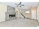Open living room showcases a modern fireplace, ceiling fan, neutral tones, and staircase at 3516 N Capitol Ave, Indianapolis, IN 46208
