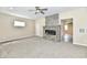 Open floor plan with a modern fireplace, sleek ceiling fan, and natural light at 3516 N Capitol Ave, Indianapolis, IN 46208