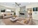 Bright living room with fireplace features two sofas, recessed lighting, and modern decor at 3516 N Capitol Ave, Indianapolis, IN 46208