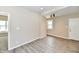 Well-lit living room showcasing modern floors, a window, and a doorway at 3516 N Capitol Ave, Indianapolis, IN 46208