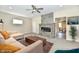 Bright living room features a fireplace, plush seating, ceiling fan, and neutral decor at 3516 N Capitol Ave, Indianapolis, IN 46208