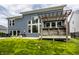 Green backyard featuring a covered hot tub, patio with furniture, grill, and verdant lawn and trees at 3640 Snowdon Dr, Westfield, IN 46074