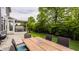 Spacious backyard patio with a dining set, grill, and a hot tub, ideal for outdoor relaxation and gatherings at 3640 Snowdon Dr, Westfield, IN 46074