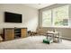 Spacious finished basement with plush carpeting, a large window, entertainment center and a play area at 3640 Snowdon Dr, Westfield, IN 46074