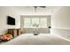 Spacious finished basement with plush carpeting, a large window and a table and chairs at 3640 Snowdon Dr, Westfield, IN 46074