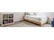 Cozy bedroom with a simple bed frame, soft rug, and a decorative storage cube at 3640 Snowdon Dr, Westfield, IN 46074