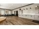 Large common area with countertop seating, cabinets, wood floors, and recessed lighting at 3640 Snowdon Dr, Westfield, IN 46074