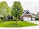 Charming two-story home featuring a brick and blue facade, complemented by a well-manicured lawn at 3640 Snowdon Dr, Westfield, IN 46074