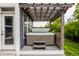 Covered hot tub with steps, adjacent to a blue house exterior and verdant landscaping with trees at 3640 Snowdon Dr, Westfield, IN 46074