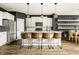 Well-appointed kitchen with stainless steel appliances, granite countertops, and a spacious island with bar seating at 3640 Snowdon Dr, Westfield, IN 46074