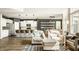 Open-concept living room with a seamless flow to the kitchen and dining area, creating a welcoming and bright space at 3640 Snowdon Dr, Westfield, IN 46074